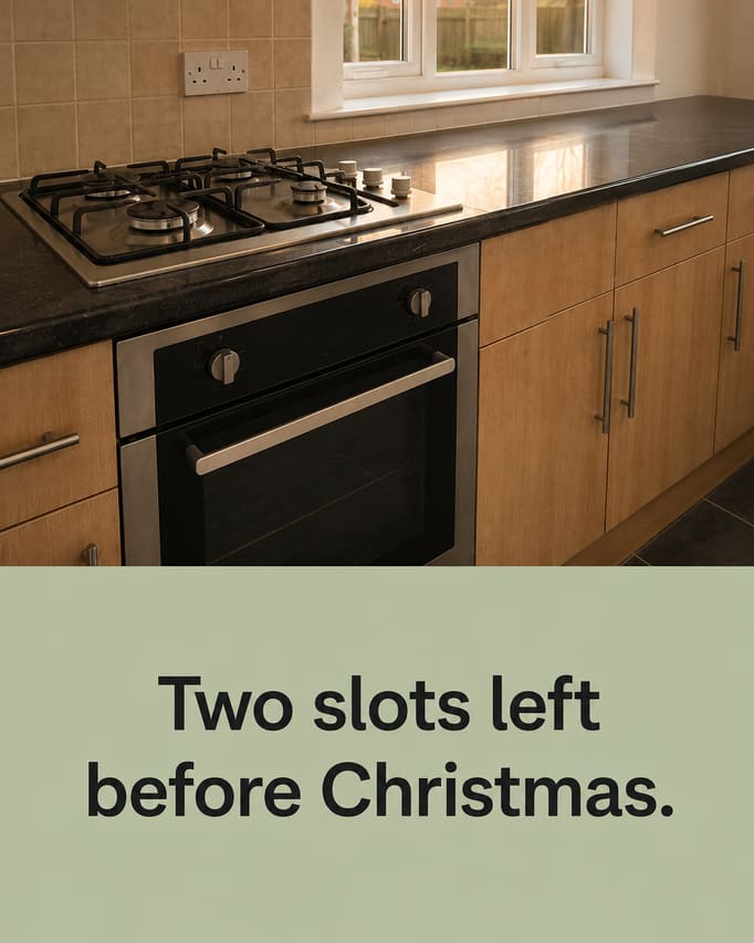 The same kitchen in a new scene, shot from a lower angle down the length of the worktop in warm evening light, with the words “Two slots left before Christmas” on a pale sage panel.